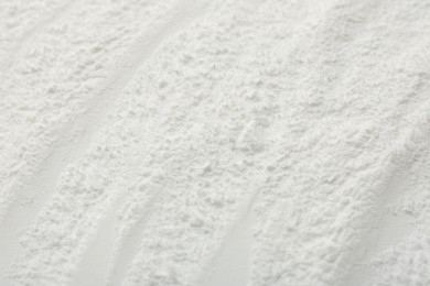 Photo of Texture of baking powder as background, closeup