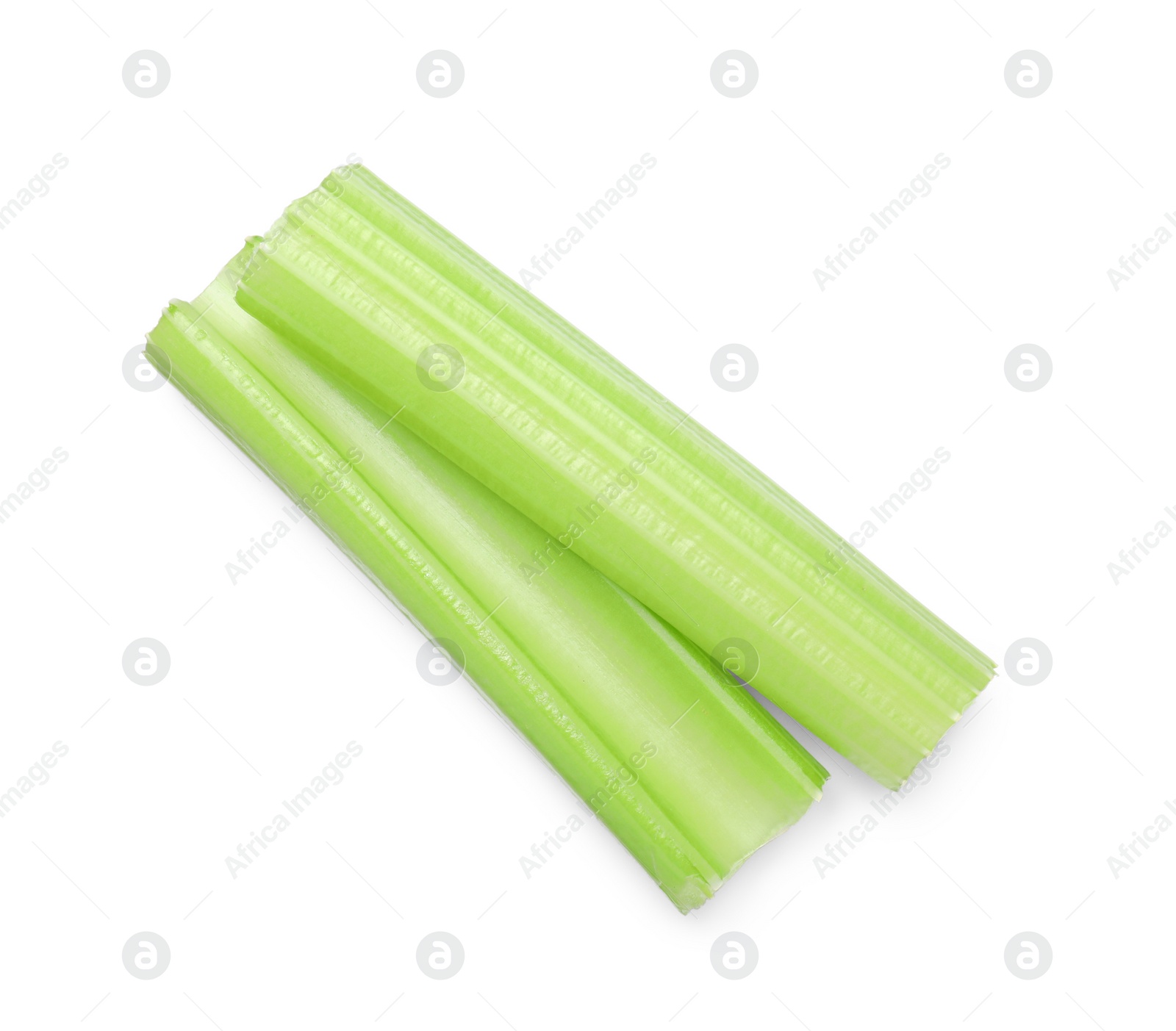 Photo of Fresh green cut celery isolated on white, top view