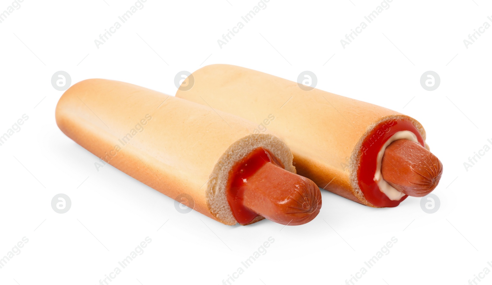 Photo of Tasty french hot dogs with sauce isolated on white
