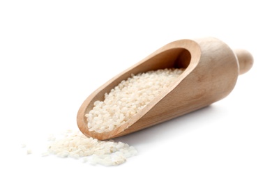 Photo of Scoop with raw rice on white background. Healthy grains and cereals