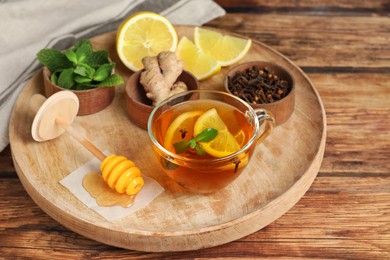 Photo of Immunity boosting drink and ingredients on wooden table