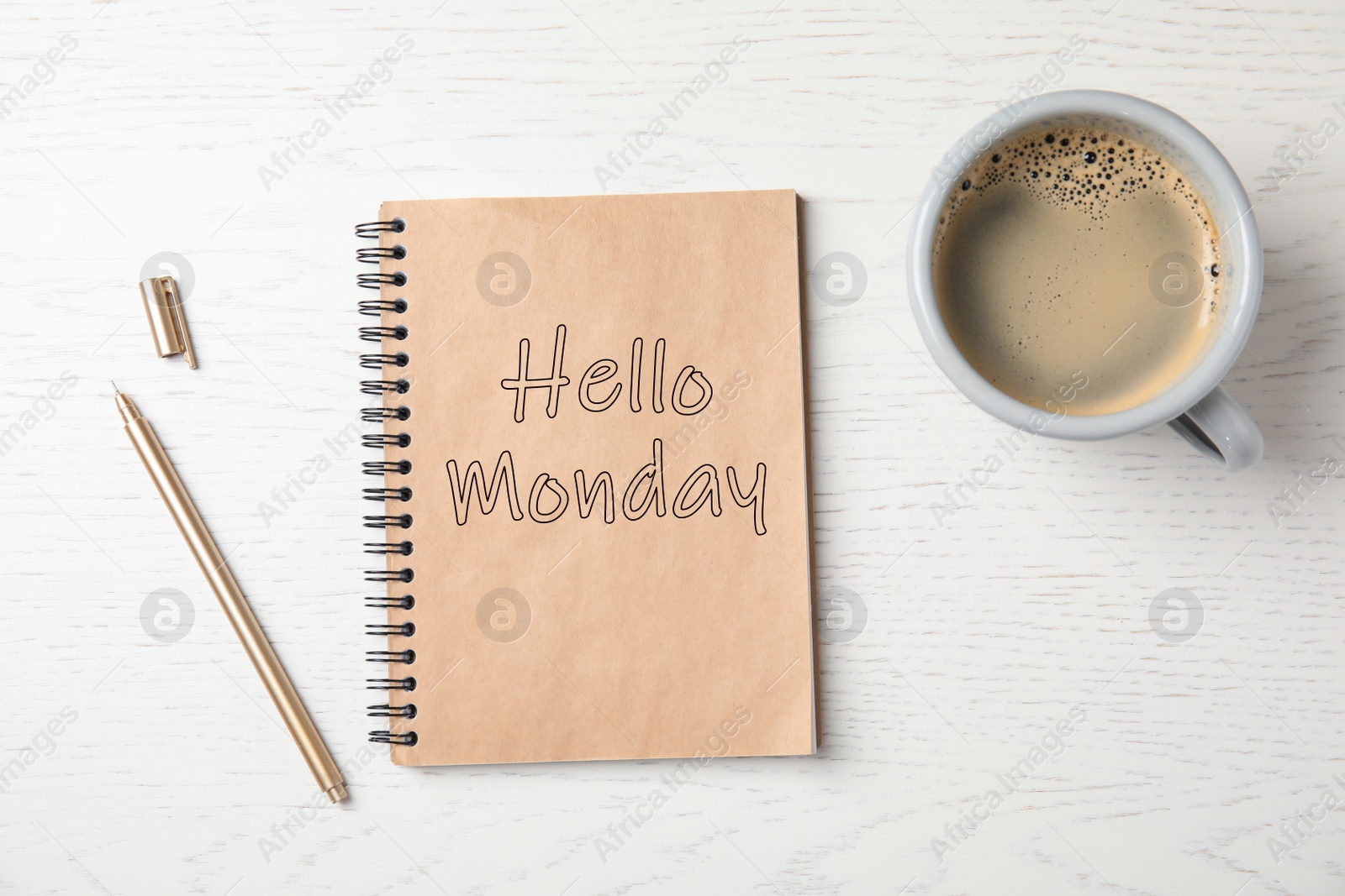 Image of Start your week with good mood. Notebook with text Hello Monday, cup of coffee and pen on white wooden table, flat lay