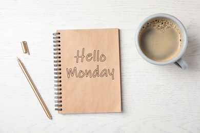 Start your week with good mood. Notebook with text Hello Monday, cup of coffee and pen on white wooden table, flat lay