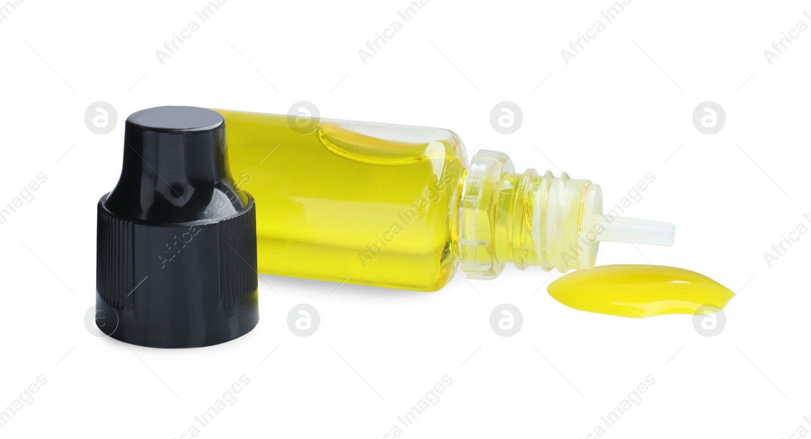 Photo of Bottle of yellow food coloring on white background