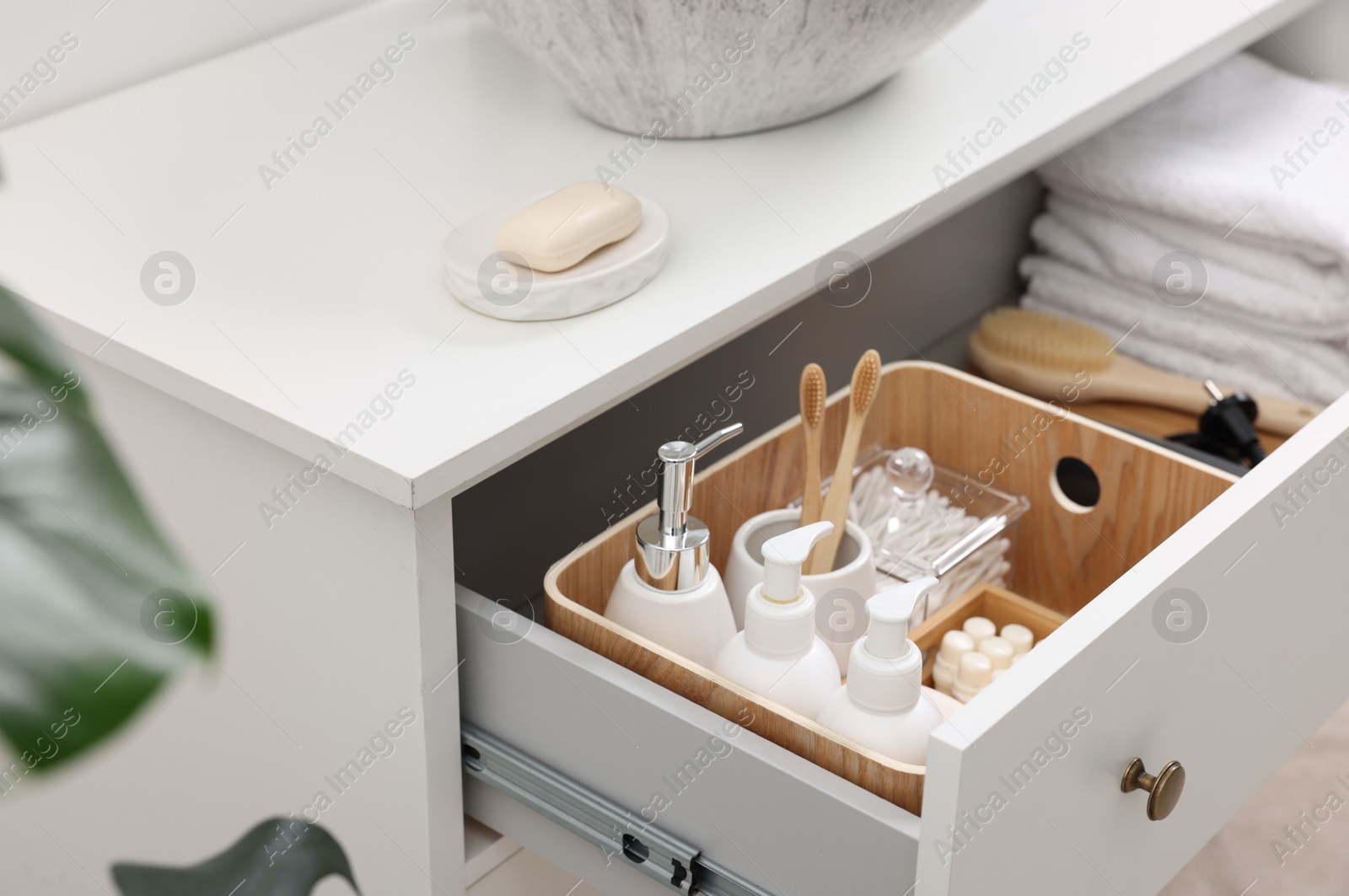 Photo of Different bath accessories and personal care products in drawer indoors