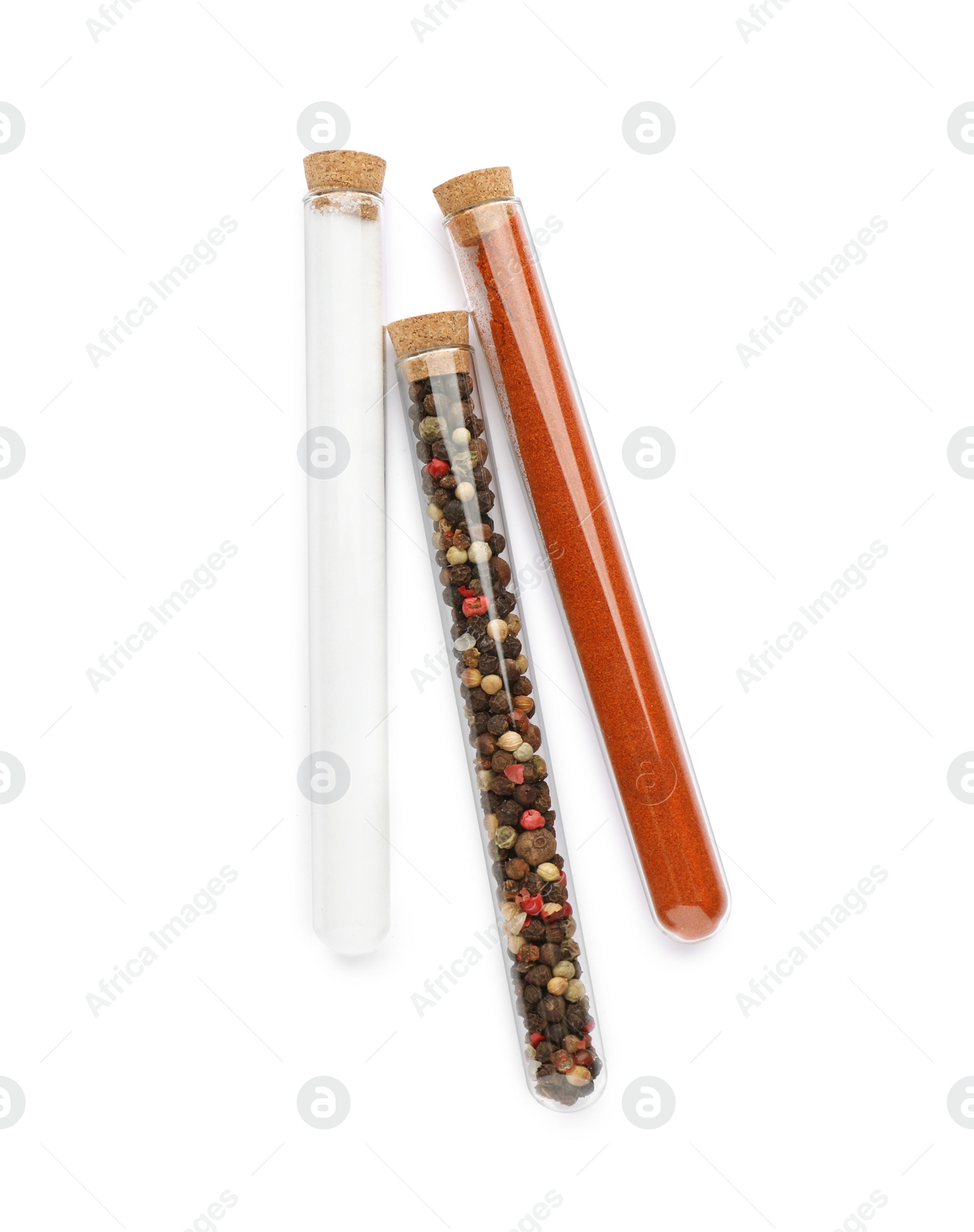 Photo of Glass tubes with different spices on white background, top view