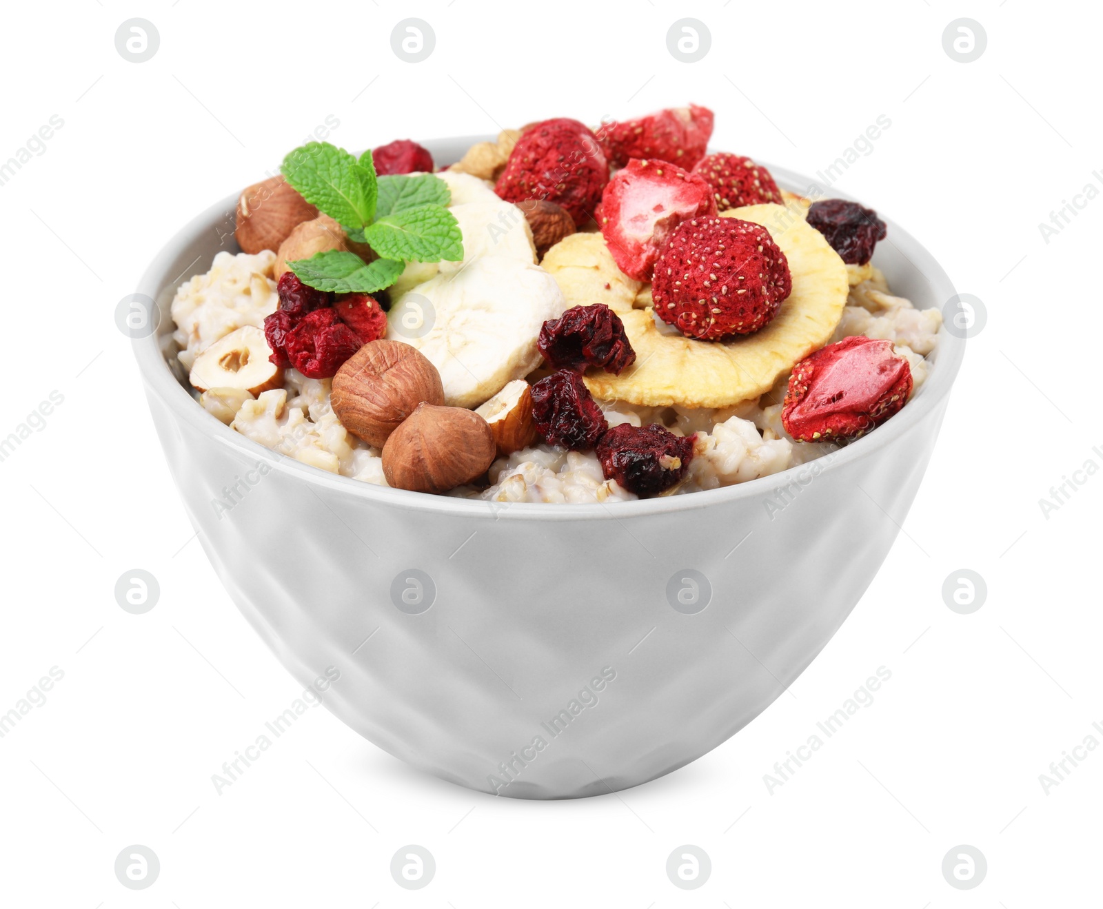 Photo of Oatmeal with freeze dried fruits, nuts and mint isolated on white