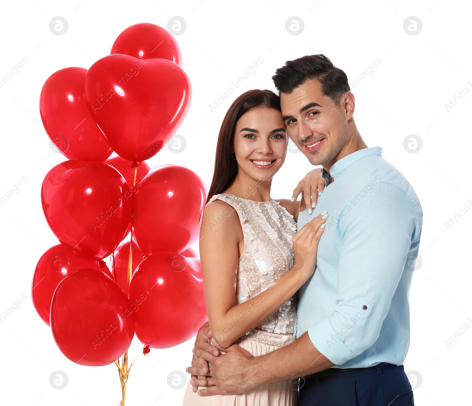 Photo of Beautiful couple with heart shaped balloons on white background