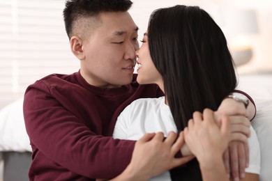 Photo of Portrait of lovely young couple at home