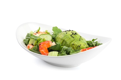 Delicious avocado salad with shrimps in bowl on white background