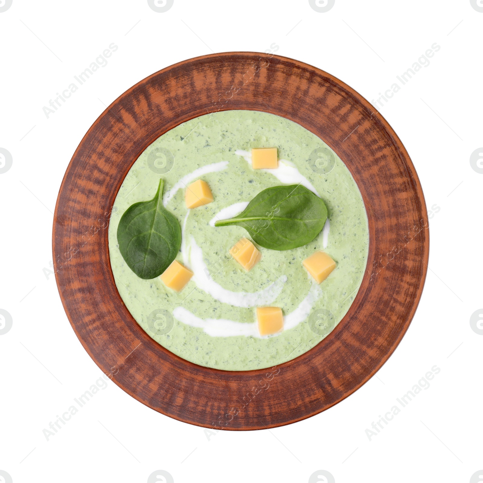 Photo of Delicious spinach cream soup with leaves and cheese in bowl isolated on white, top view