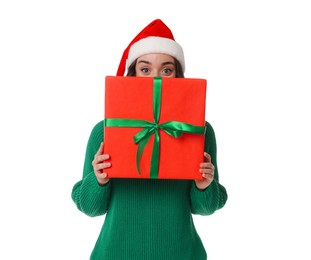 Photo of Beautiful young woman in Santa hat with Christmas celebration gift isolated on white