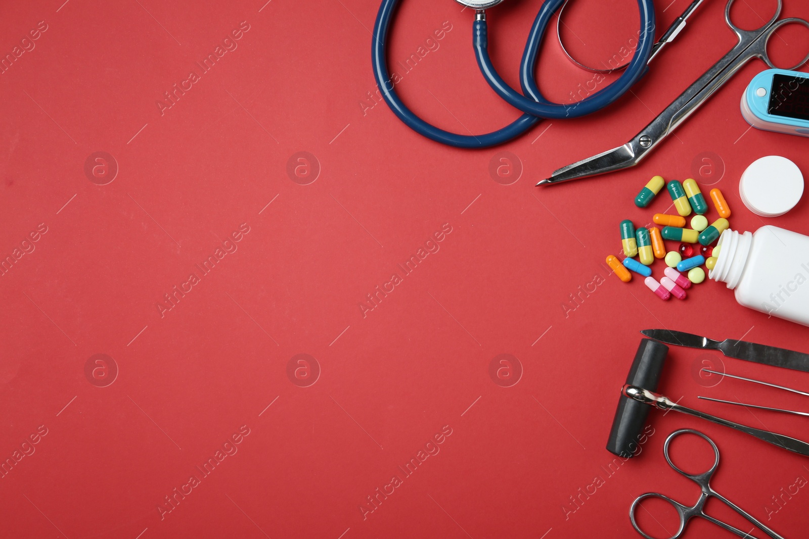 Photo of Flat lay composition with different medical objects and space for text on color background