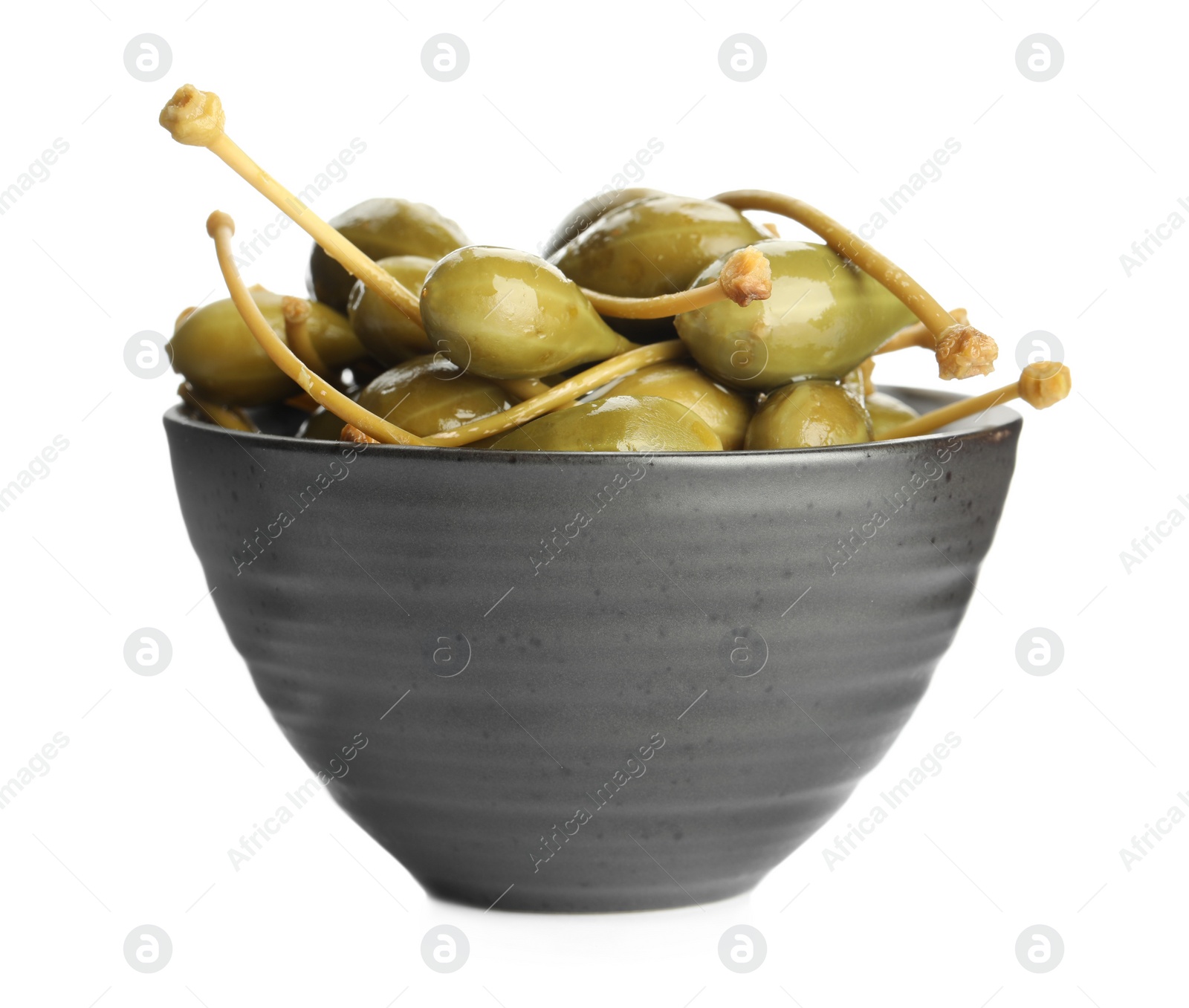 Photo of Many capers in bowl isolated on white