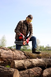 Photo of Man with modern saw on sunny day