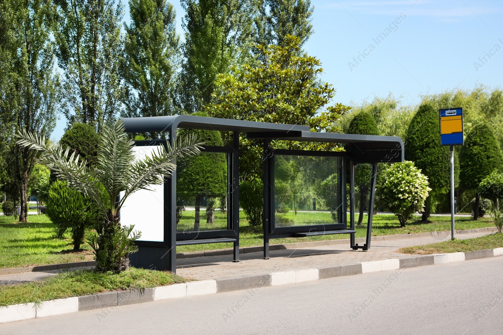 Photo of Public transport stop with benches on city street