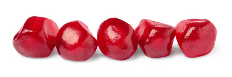 Photo of Juicy red pomegranate seeds on white background