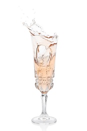 Photo of Glass of rose champagne on white background