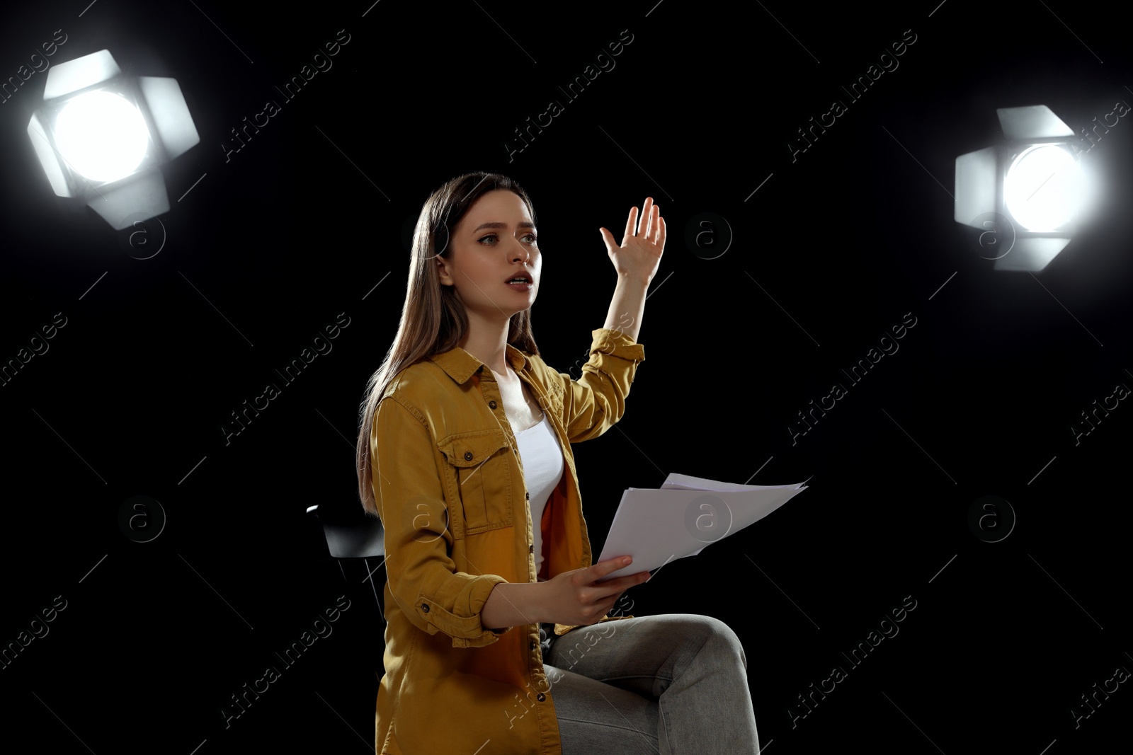 Photo of Professional actress rehearsing on stage in theatre