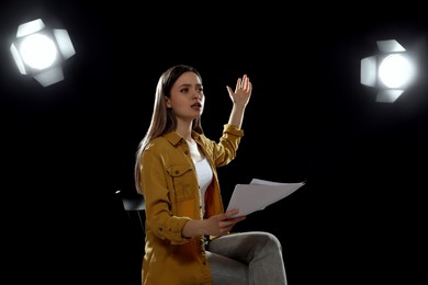 Professional actress rehearsing on stage in theatre