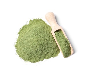 Photo of Pile of wheat grass powder and scoop isolated on white, top view