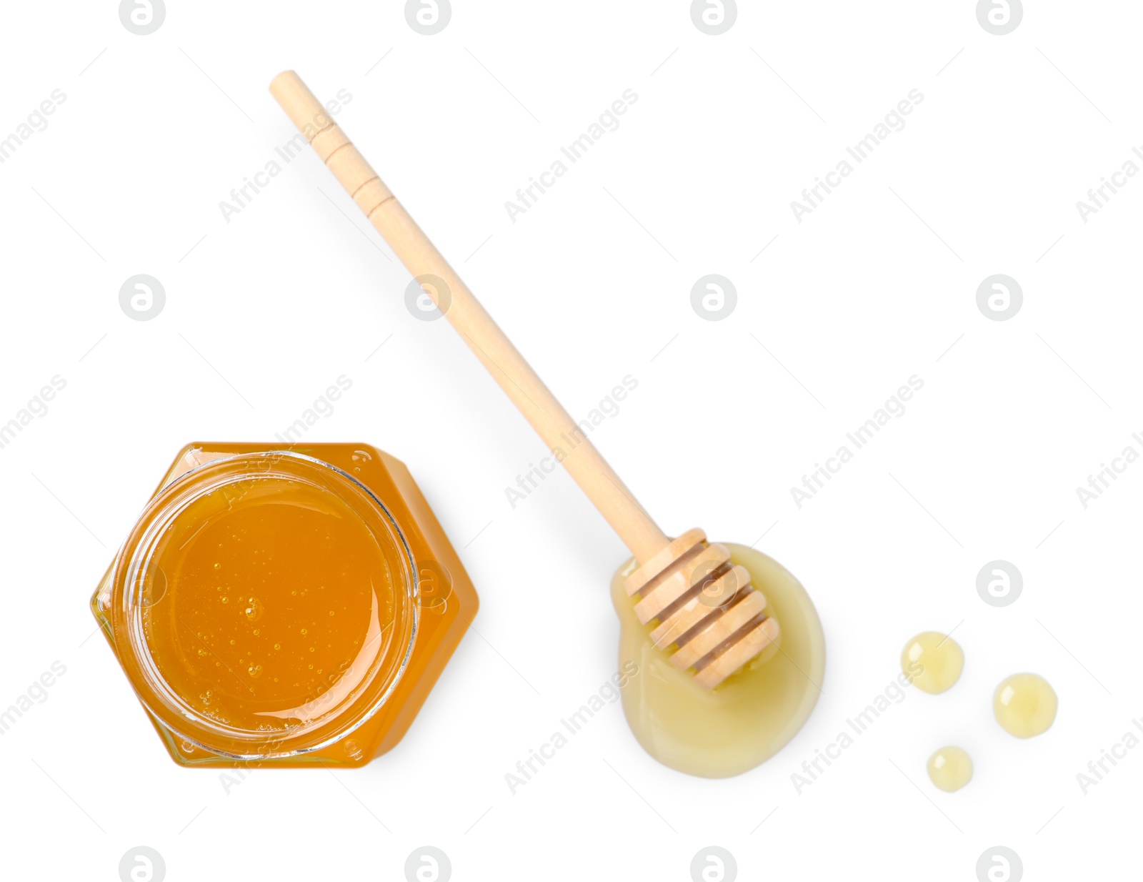 Photo of Tasty honey in glass jar and dipper isolated on white, top view. Space for text