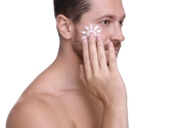 Photo of Handsome man applying sun protection cream onto his face against white background