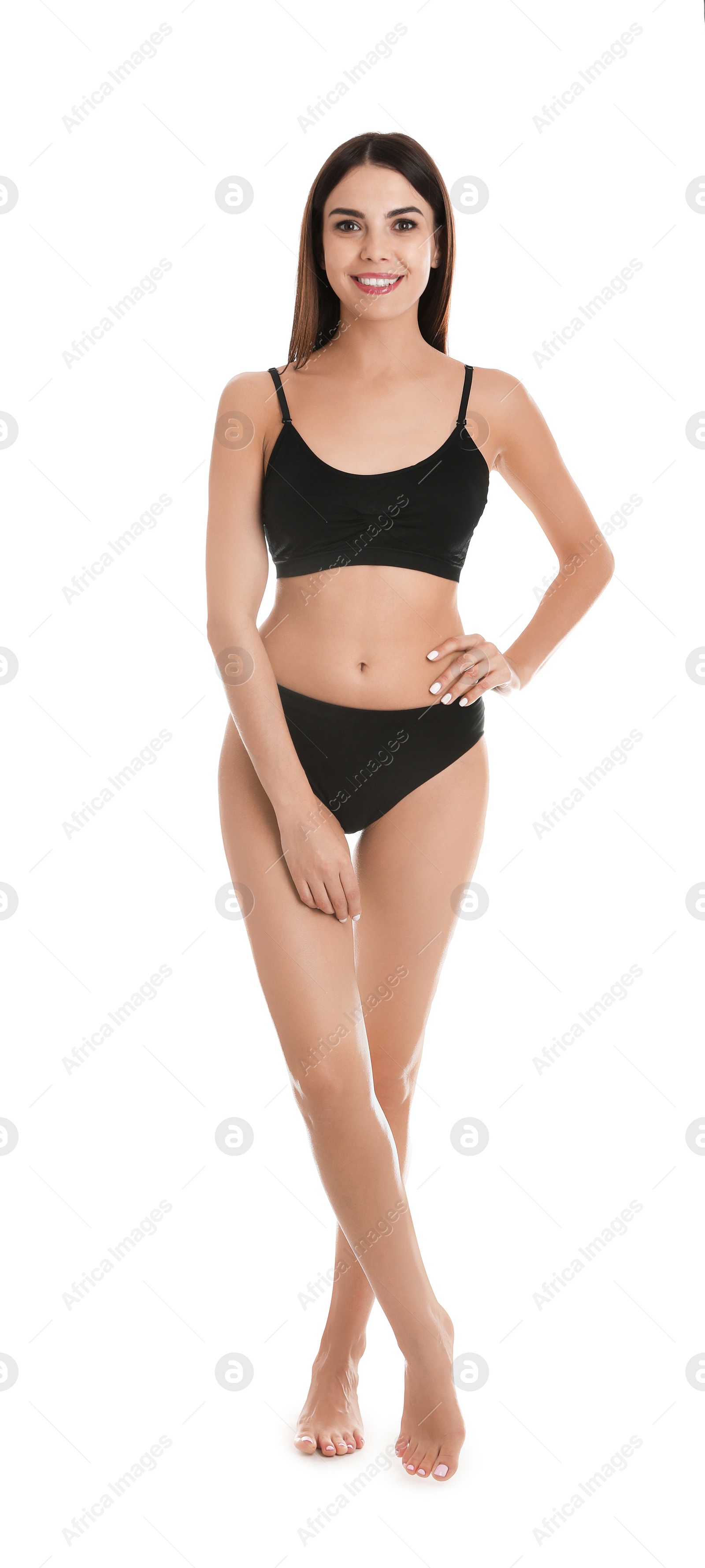 Photo of Full length portrait of attractive young woman with slim body in underwear on white background