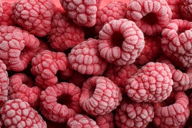 Photo of Tasty frozen raspberries as background, top view