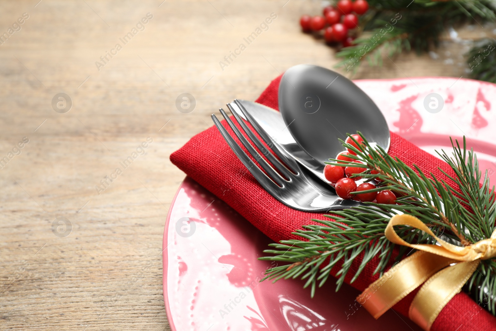 Photo of Christmas table setting on wooden background, closeup