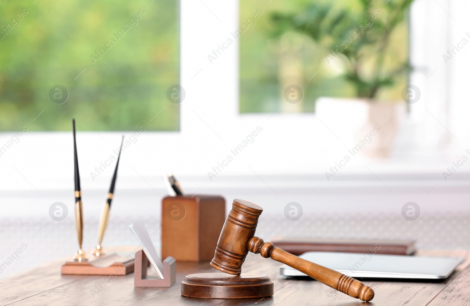 Photo of Table with judge gavel in lawyer's office