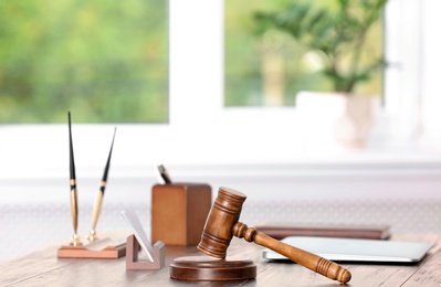 Table with judge gavel in lawyer's office