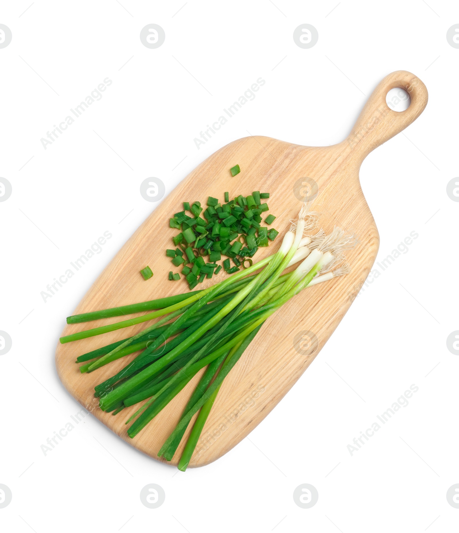 Photo of Wooden board with green spring onions on white background, top view