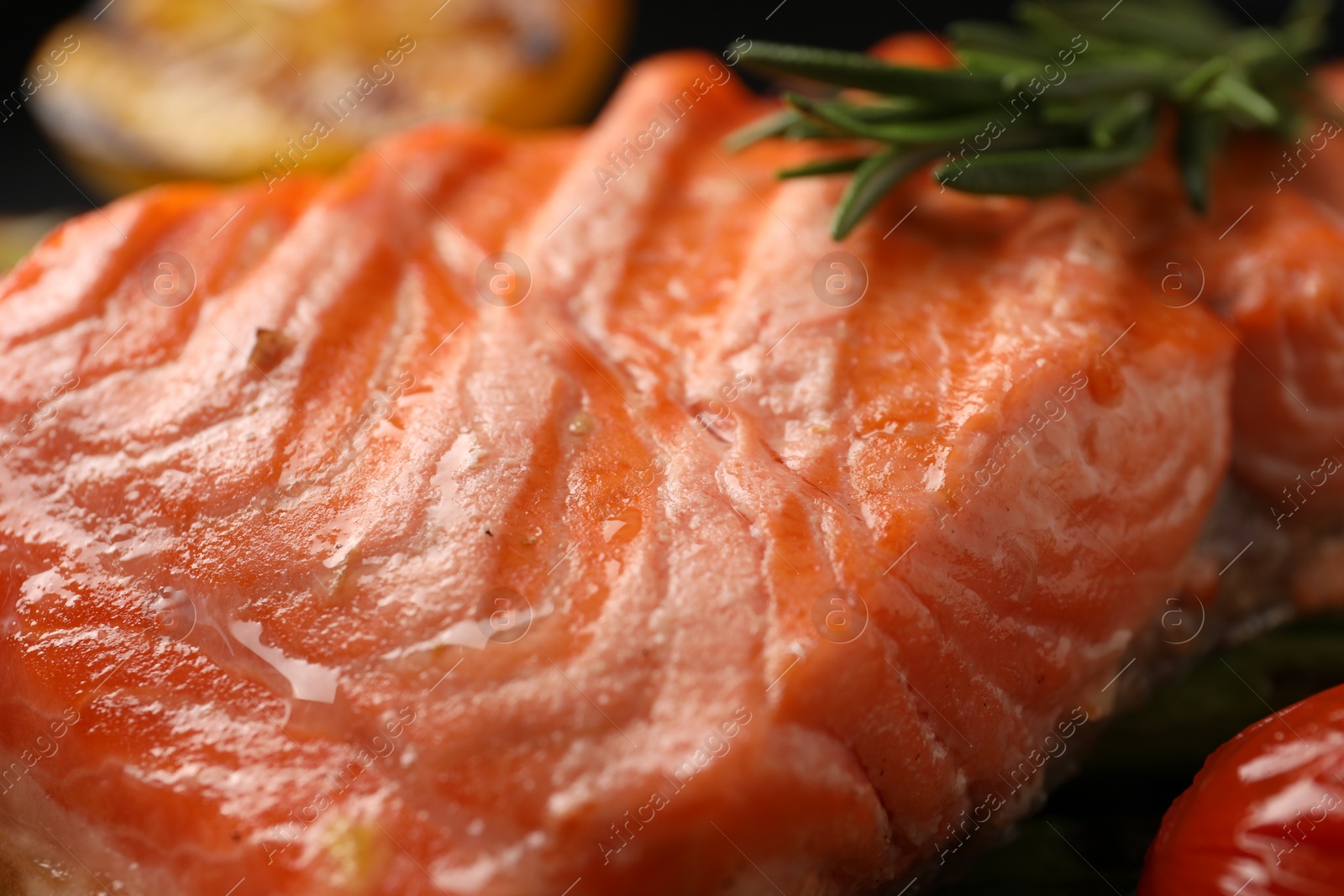 Photo of Tasty grilled salmon with rosemary, closeup view