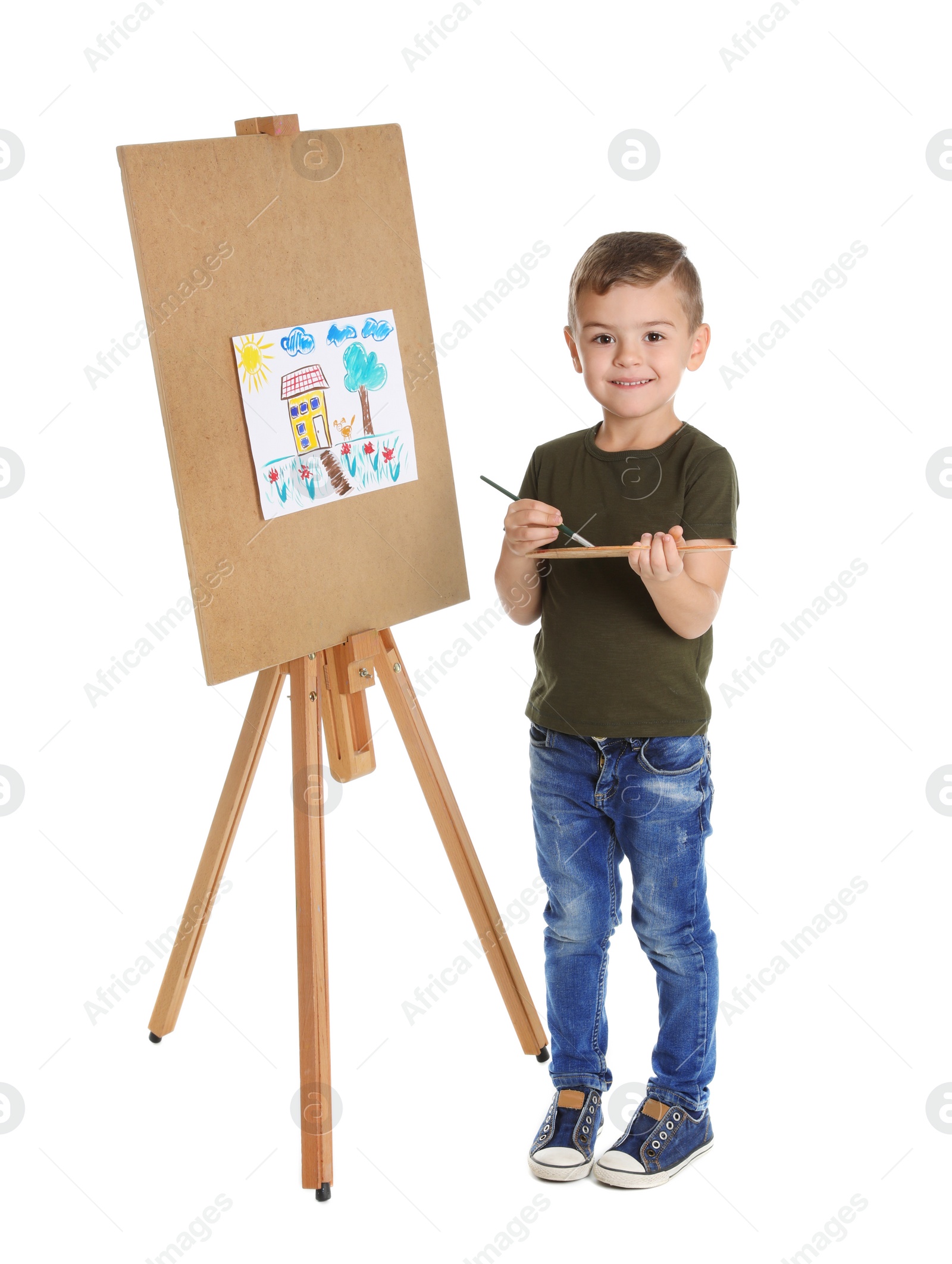 Photo of Child painting picture on easel against white background