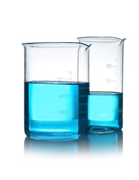 Photo of Beakers with liquid on table against white background. Laboratory analysis