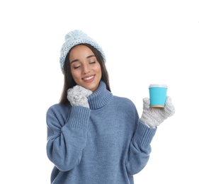 Photo of Happy beautiful woman with paper cup of mulled wine on white background