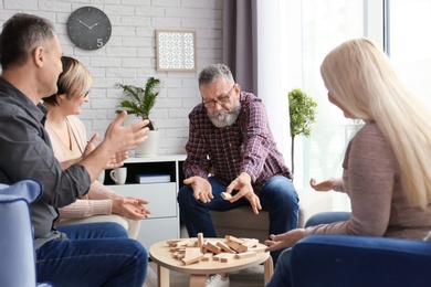 Photo of Happy senior couples spending time together at home