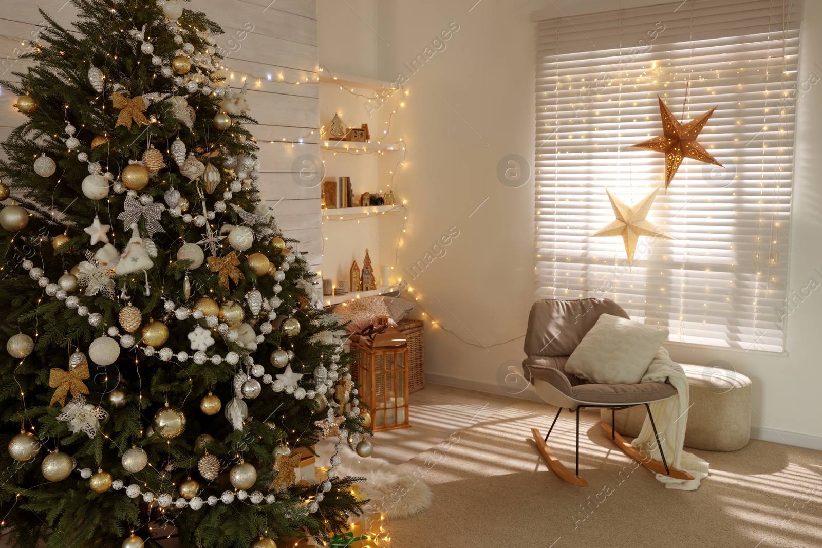 Photo of Decorated Christmas tree in stylish living room interior