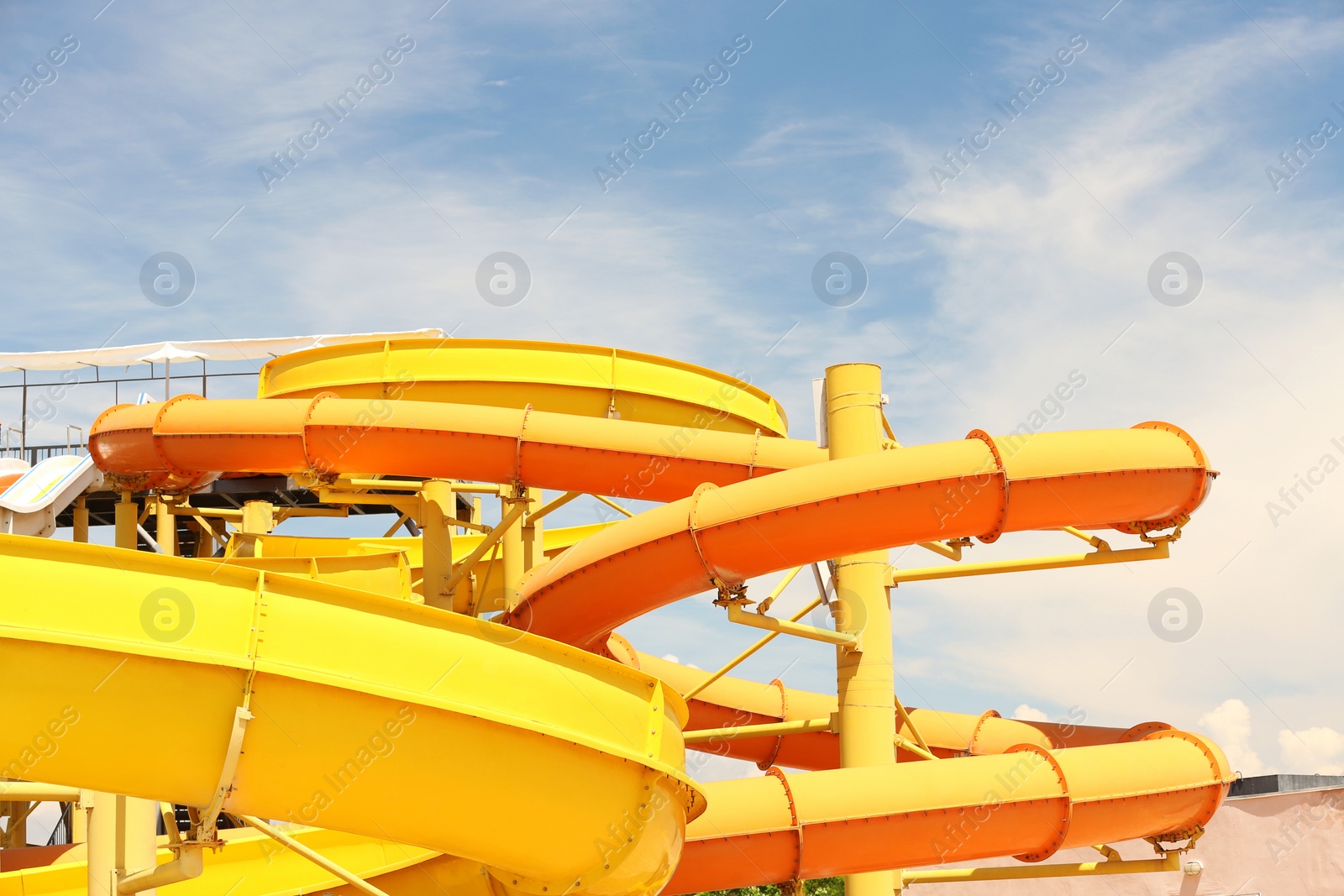 Photo of Different colorful slides in water park on sunny day