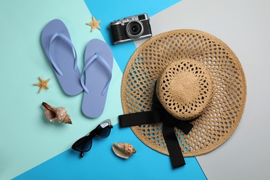 Flat lay composition with beach objects on color background