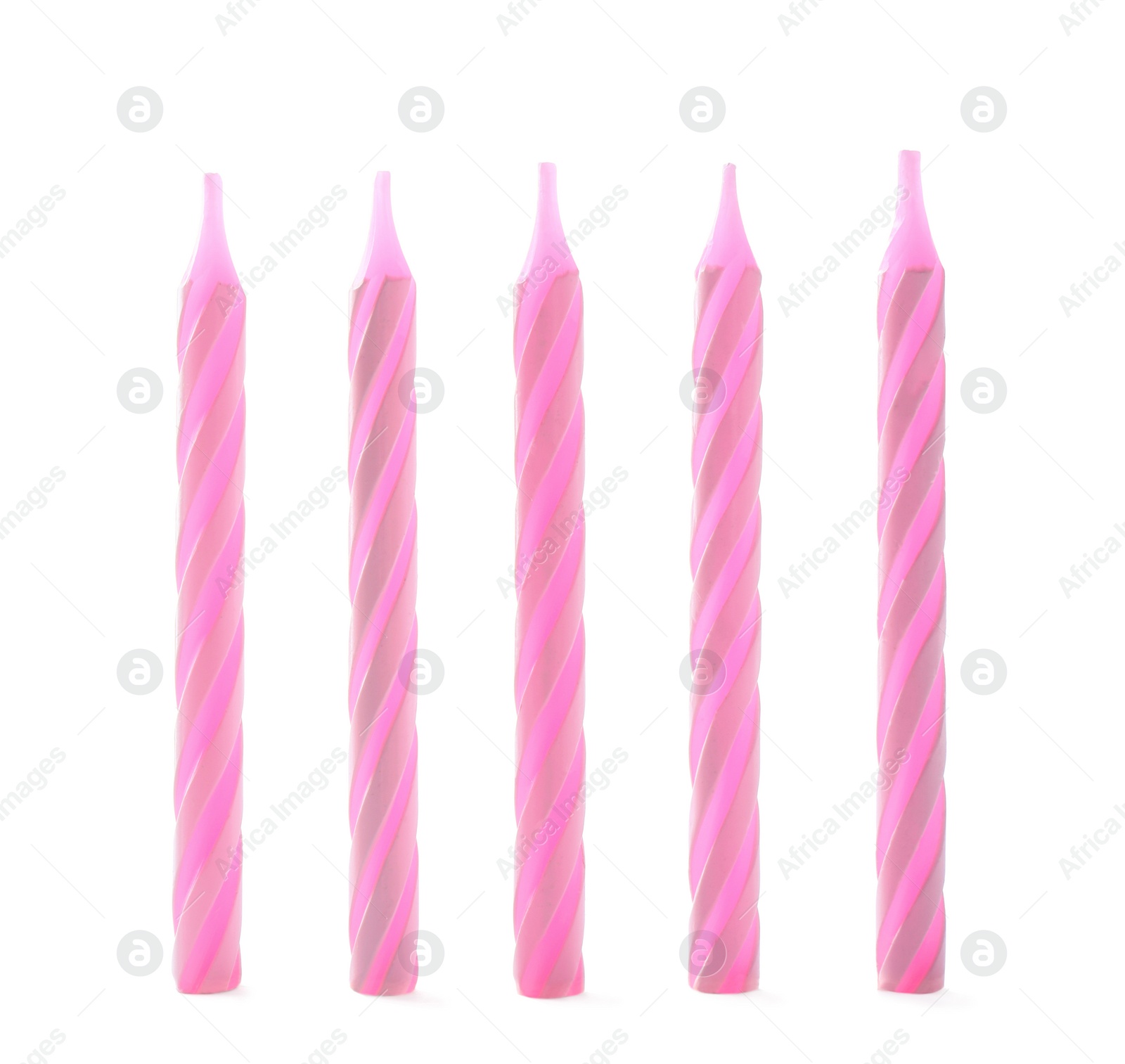 Photo of Pink striped birthday candles isolated on white