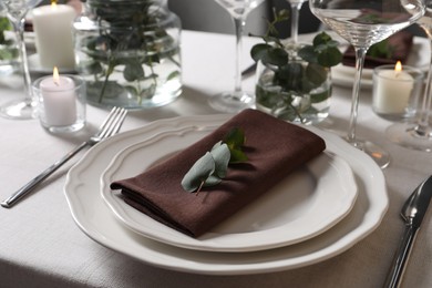 Photo of Beautiful table setting with silverware and floral decor