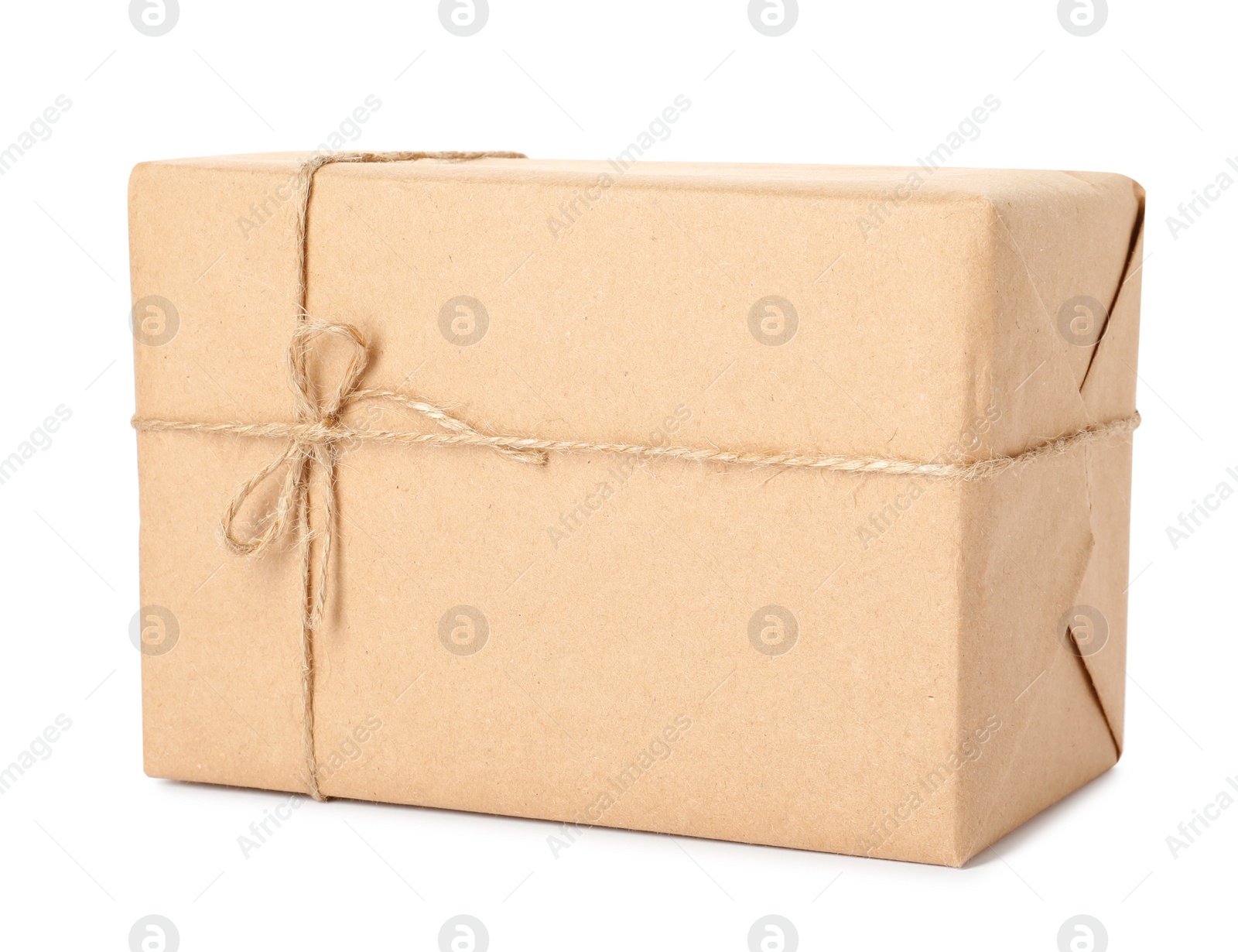 Photo of Parcel wrapped with kraft paper and twine isolated on white