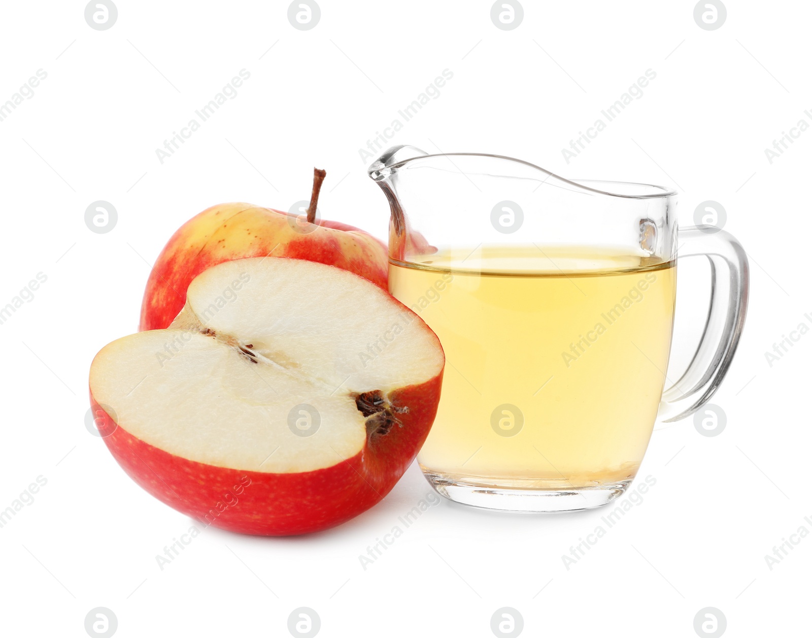 Photo of Vinegar in glass pitcher and fresh apples on white background