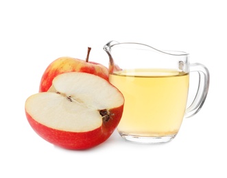Photo of Vinegar in glass pitcher and fresh apples on white background