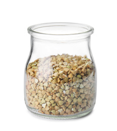 Photo of Uncooked green buckwheat grains in jar isolated on white