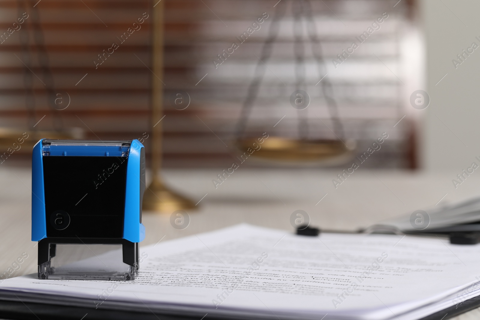 Photo of Notary contract. Documents and stamp on table, space for text