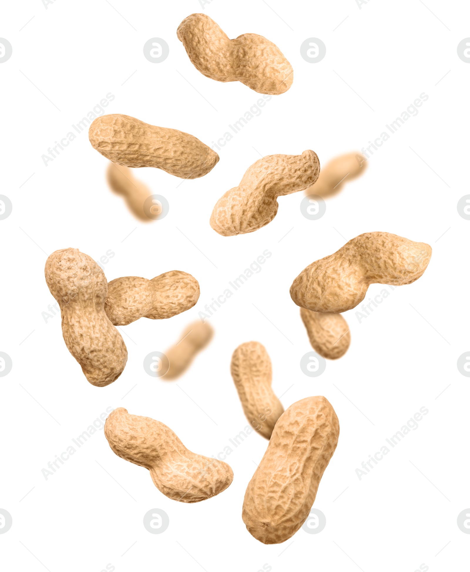 Image of Unpeeled peanuts in air on white background