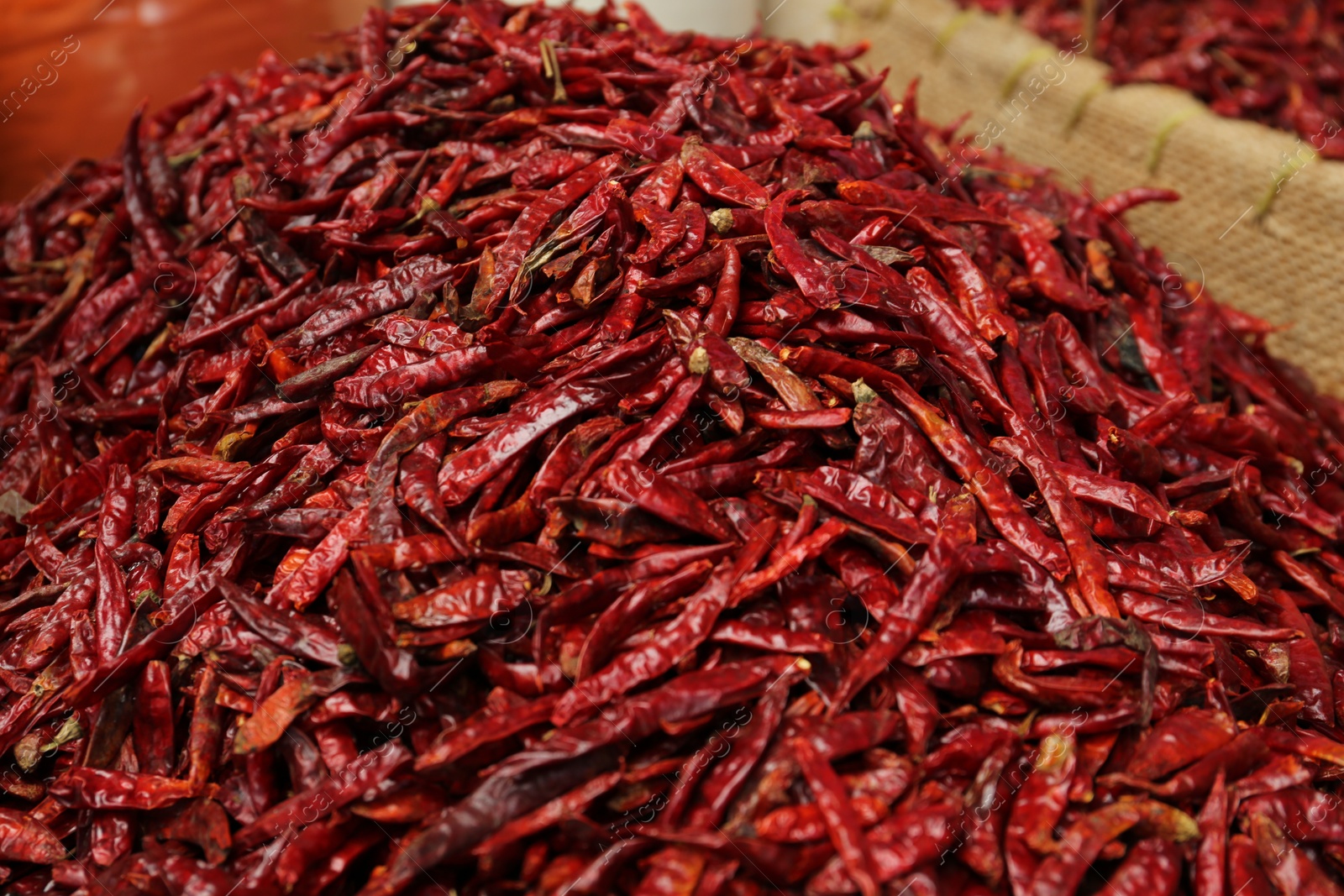 Photo of Pile of spicy dried red chili peppers at market